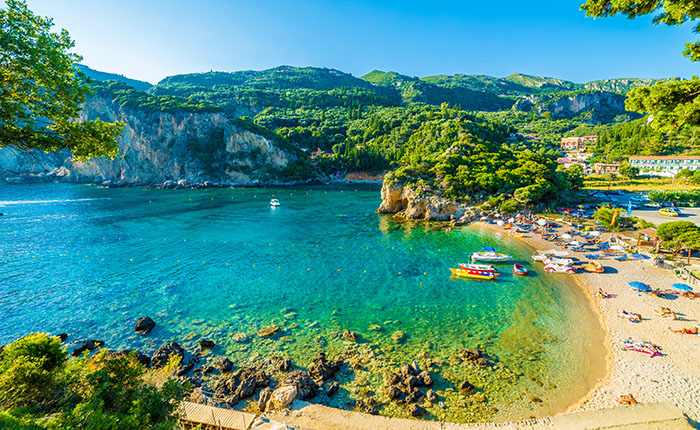 Beautiful beach and boat in Paleokastritsa, Corfu island, Greece