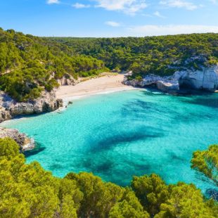 View of Mitjaneta beach with beautiful turquoise sea water, Meno