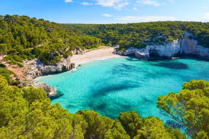 View of Mitjaneta beach with beautiful turquoise sea water, Meno