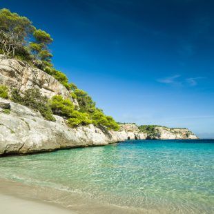 For calm turquoise waters and a charming ambience, head to Menorca's Cala Macarella
