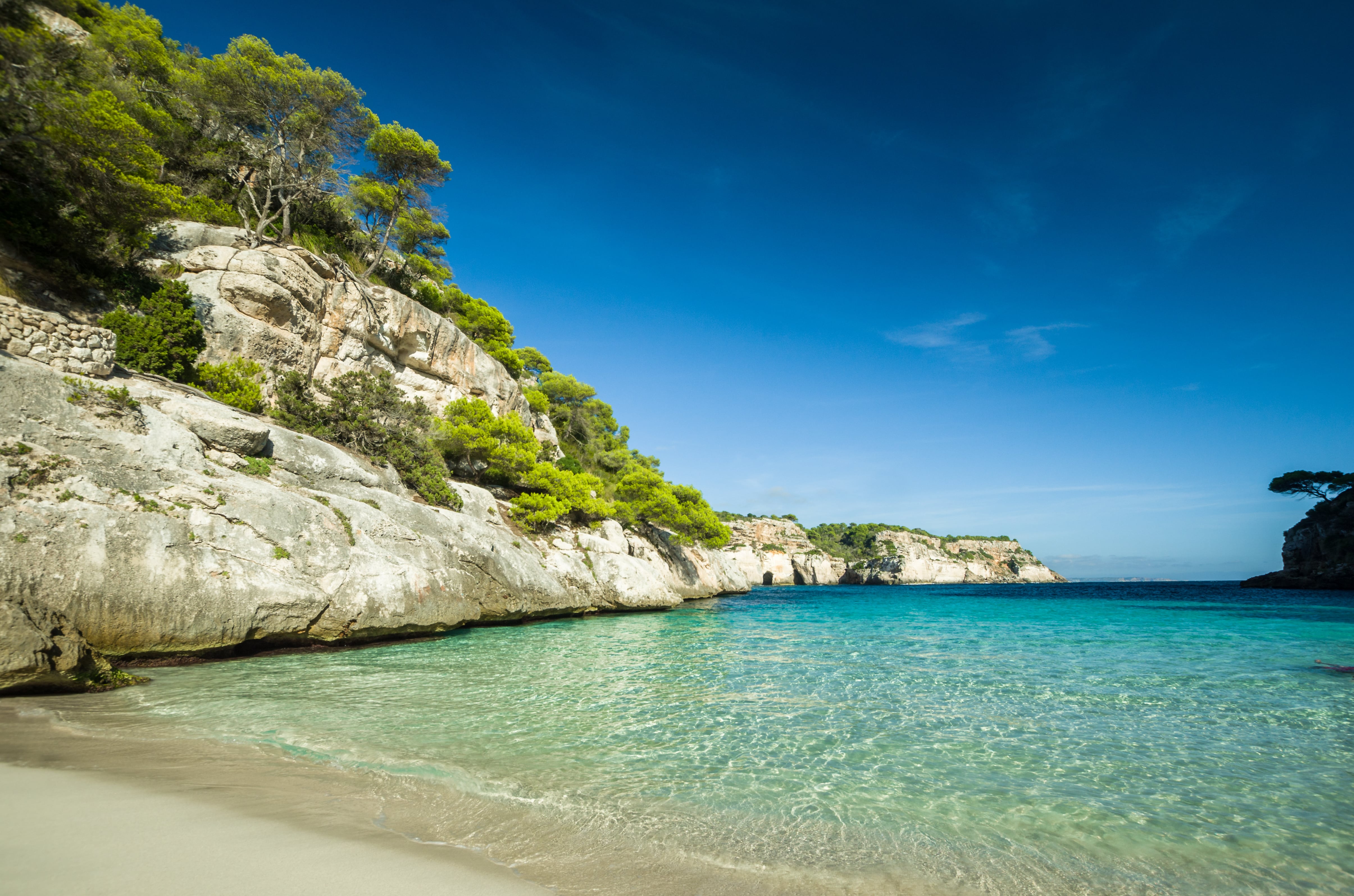 For calm turquoise waters and a charming ambience, head to Menorca's Cala Macarella